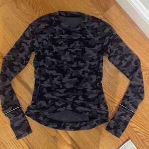 Size 0 Lululemon, camo long sleeve. Great condition and warm thick material.